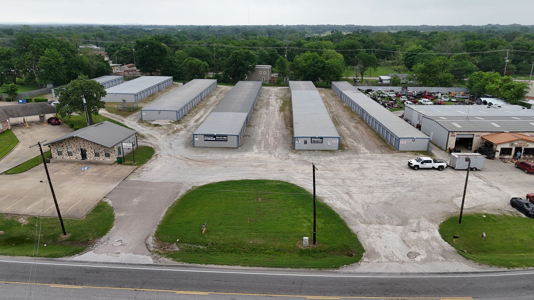 Aerial view of Arborstone Storage Fairfield from W Commerce St: the stone office building and long rows of drive-up storage buildings behind it.