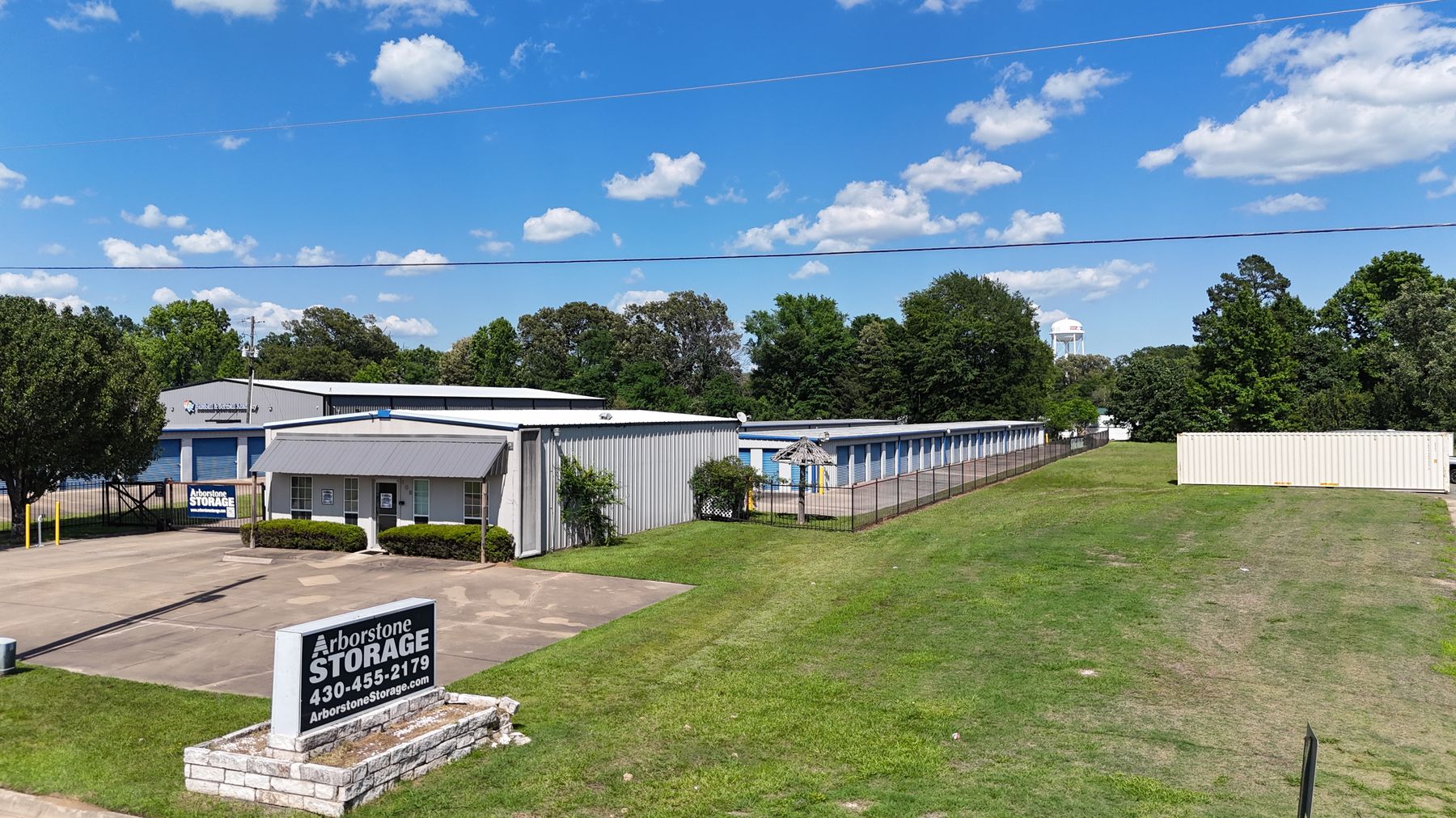Arborstone Storage Nash: the stone monument sign in front of the office and blue-door storage buildings on Industrial Blvd.