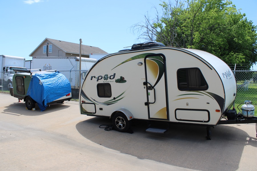 Travel trailers parked on a lot at an Arborstone Storage facility