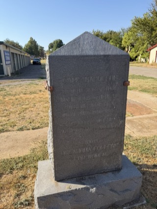 The granite Camp Napoleon marker at Arborstone Storage Verden, its engraved face reading Camp Napoleon above the 1865 compact inscription.